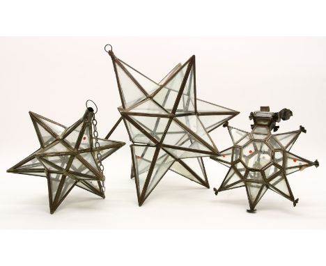 An Indian tin and glazed star shaped hanging lantern, 30cm high together with three other similar examples, a similar example