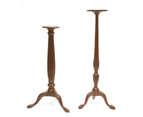 Two mahogany torchères, 20th century, each with a reeded column, 137 and 114cm high (2)