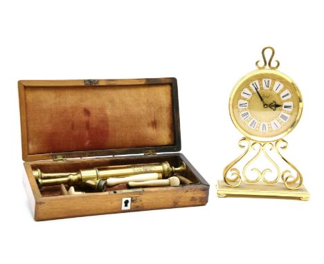 A H. Wright of London 19th century mahogany cased brass and bone enema set, together with an Imhof brass cased mantel clock (