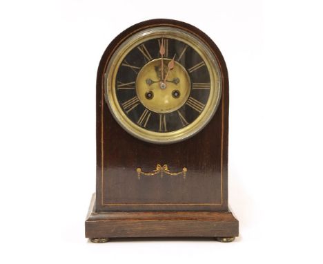 An Edwardian strung mahogany mantel clock, of domed shape, the drum movement striking on a gong, 31cm high