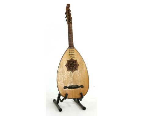 An early 20th Century lute, labelled 'Joh. Reiter, Instumenten-macher, Mittenwald, Bayern', of typical form with a carved pie