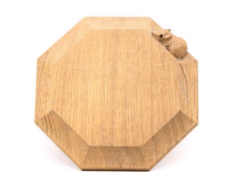 A Robert 'Mouseman' Thompson oak teapot stand, of octagonal form with carved mouse signature, diameter 19cm