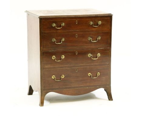 A George III mahogany commode chest, with fall front on swept feet, 70cm wide, 40cm deep, 75cm high