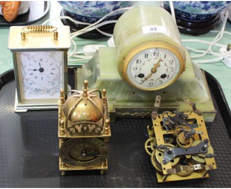 An onyx striking mantel clock, two others plus a movement