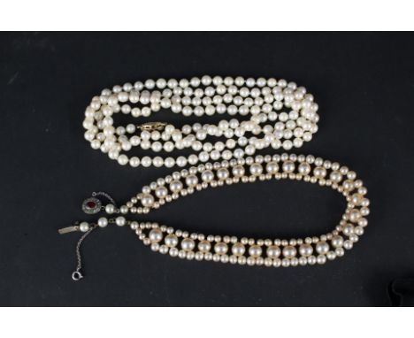 An opera length cultured pearl necklace with 9ct gold stone set clasp plus a faux pearl choker with stone set silver clasp