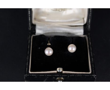 A pair of 9ct gold single pearl set earrings