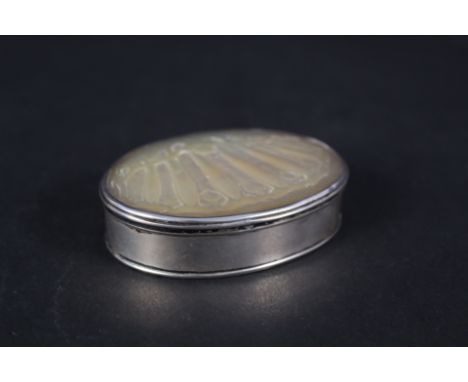 A late 17th Century white metal oval box with carved mother of pearl inset lid