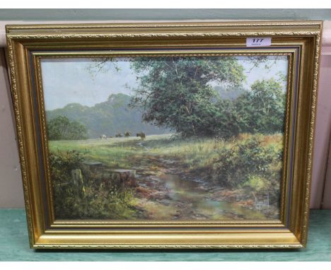 An oleograph of a woodland and meadow scene with cattle, 11" x 15"