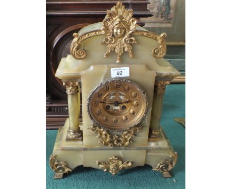 A French green marble and gilt metal striking mantel clock