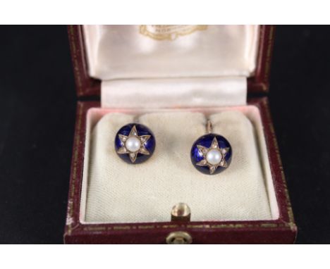 A pair of yellow metal dome shaped earrings with blue enamel background, central pearl and diamonds in star shaped setting (s