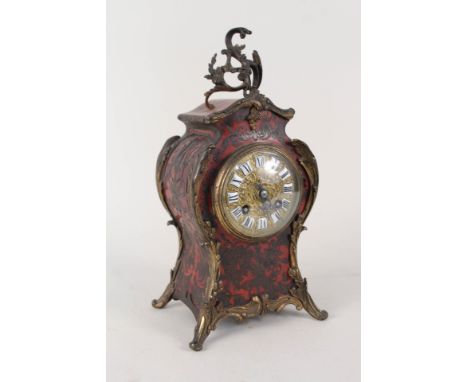 A 19th Century French boulle waisted mantel clock with Rococo gilt metal mounts