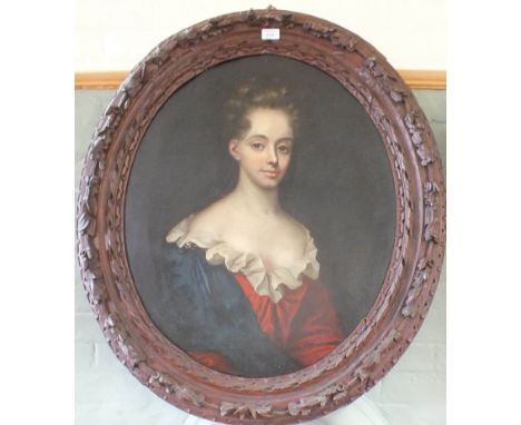 A 19th Century oval oil on canvas of a half length portrait of a lady in foliate carved frame, 28" x 24"