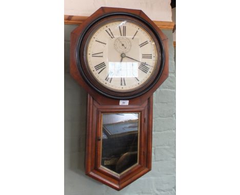An octagonal mahogany drop dial wall clock