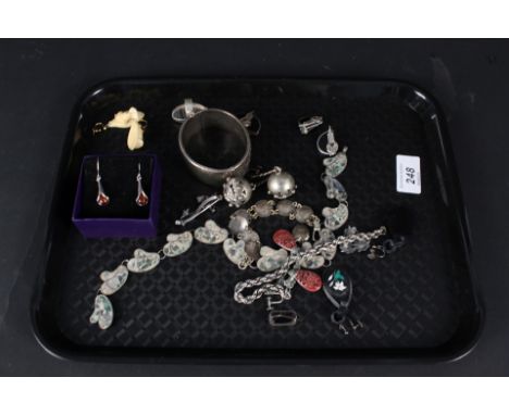 A quantity of silver and white metal jewellery including foliate bangle, Art Deco style stone set brooch and earrings etc tog