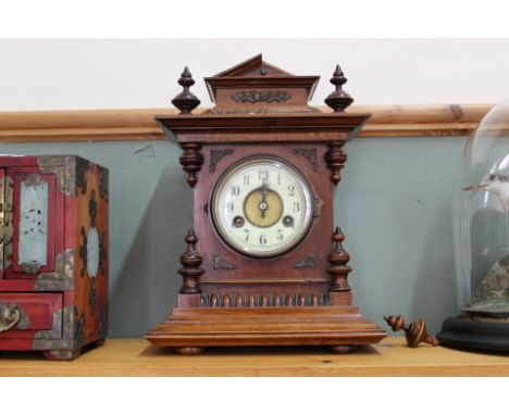 A mahogany striking mantel clock