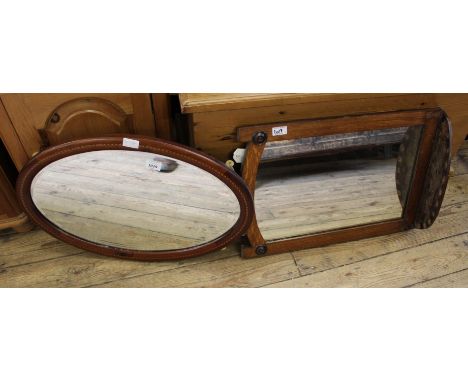 An Edwardian mahogany oval mirror and oak hanging mirror with shelf