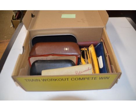 A box of vintage glasses and sunglasses 