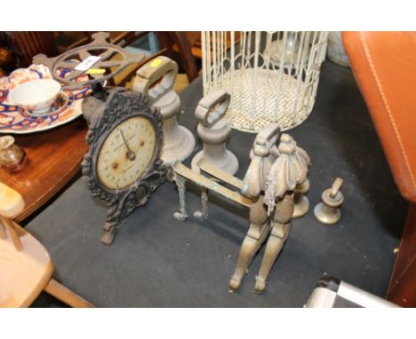 Two sets of household scales, a pair of brass fire dogs; and a set of bell weights, some to be viewed in cabinet