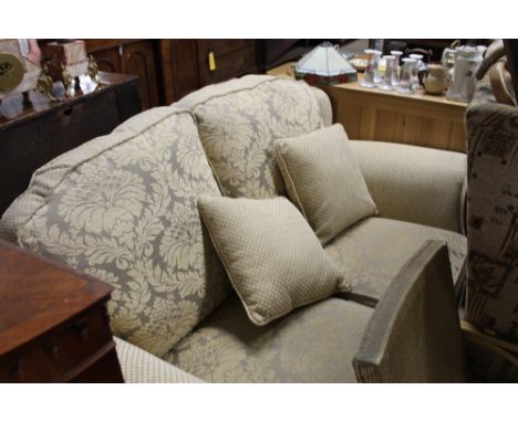 A floral upholstered two seater sofa