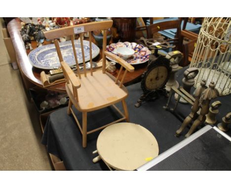 A wooden stick backed dolls chair; a small circular topped table and a folding table