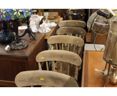 A set of six stripped elm stick back kitchen chairs