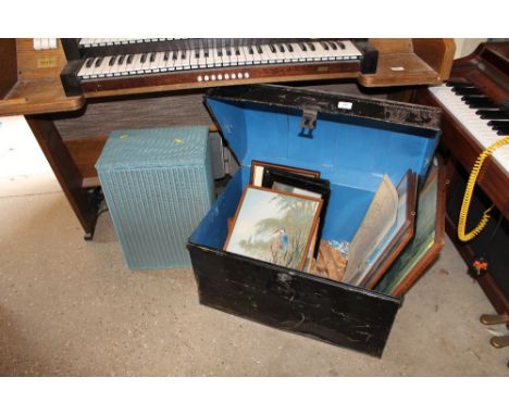 A metal dome topped trunk and a Lloyd loom linen basket with various pictures, prints and watercolours