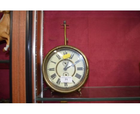 A large brass cased alarm clock 