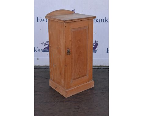 A pine pot cupboard, panel door with shelf to interior raised on plinth base. 38.5 cm wide x 34 cm deep x 82 cm high.