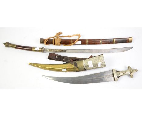 Indonesian sword and a jambiya with brass and white metal scabbard