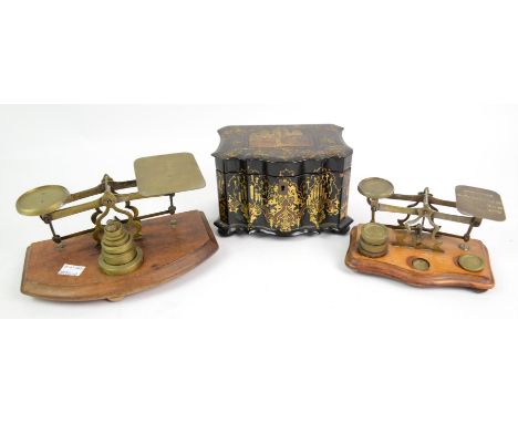A Victorian papier mache tea caddy, of serpentine form, decorated with a Moorish scene within gilt framing, the lifting lid c