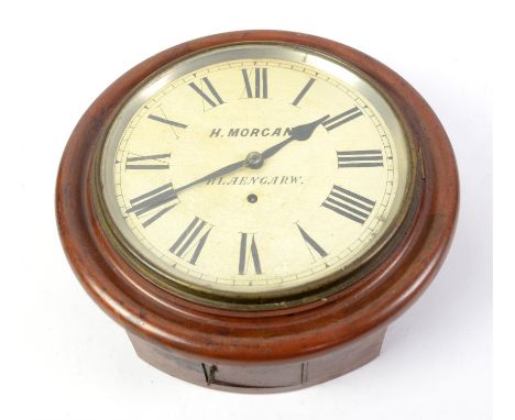 H.Morgan Wall clock.Condition Report:  There is overall wear to the face of the clock.The front door opens but access to the 