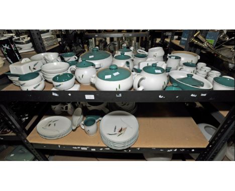 A Denby Greenwheat pattern part dinner service comprising of seven bowls, three tea pots, six tea cups, three tureens, two ju