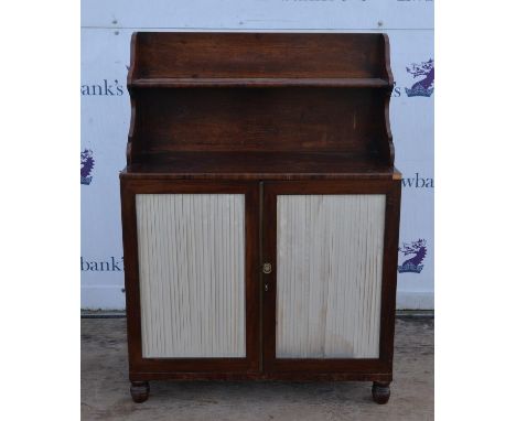 Early 19th century mahogany chiffonier, the raised back with shelf over two silk lined doors on turned feet, H128 W93 D41 cm 