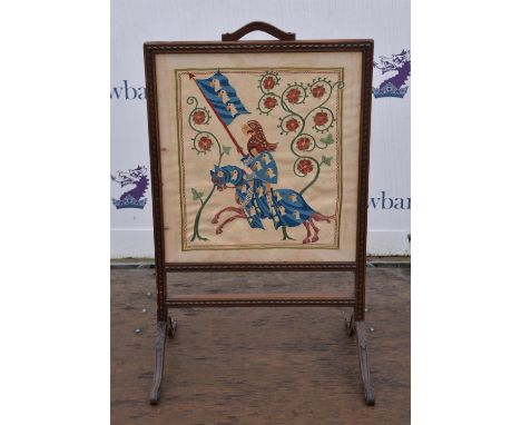A mahogany framed fire screen, with embodied panel raised on carved supports.  91 cm high x 56 cm wide
