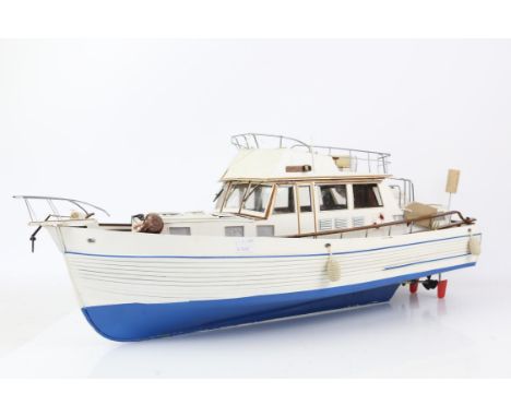 Painted plywood and fibre glass model of a motor cruiser with two decks, 76cm long,
