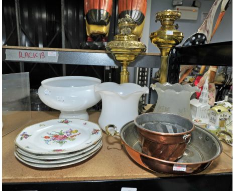Three opalescent glass light shades, two brass oil lamps, four plates a copper pan and a copper jelly mould.