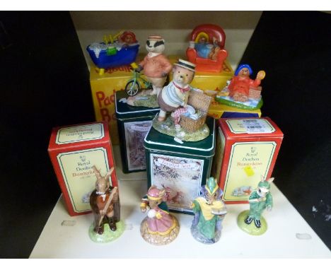 A group of seven boxed ceramic figures to include two Bunnykins, Foxwood tales &  Coalport Paddington bear and two others