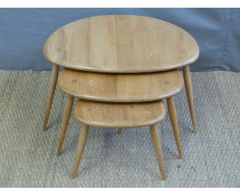 A nest of retro light elm Ercol pebble tables.