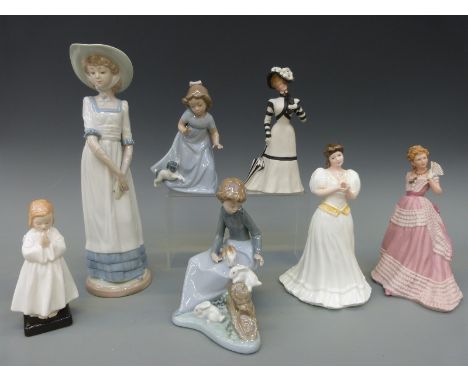 A group of seven figures to include Royal Doulton Praying HN1978, Maria HN3381, two bisque figures by Wedgwood, Enchanted Eve