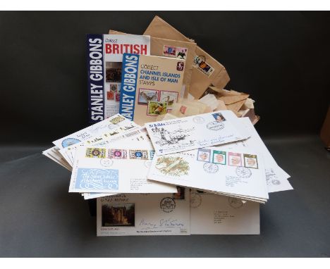 Two box files of GB first day covers, stamps on covers, loose all world stamps and two GB catalogues