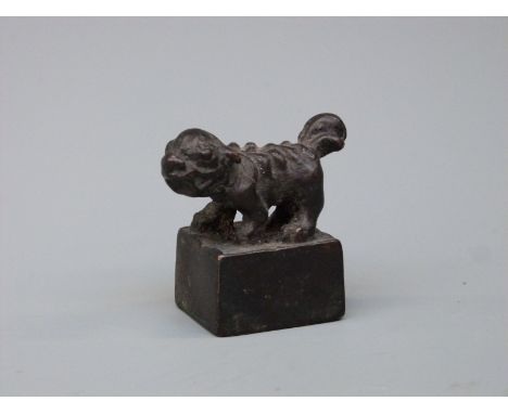 A 19thC bronze Dog of Fo seal with four character mark to base, 4cm tall