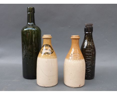 A collection of 19thC and later glass and stoneware bottles to include Newport, Rippon, R . Whites etc