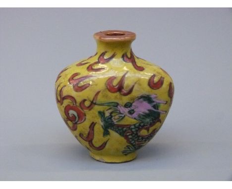 A Chinese porcelain snuff bottle with dragon decoration, 5.2cm tall