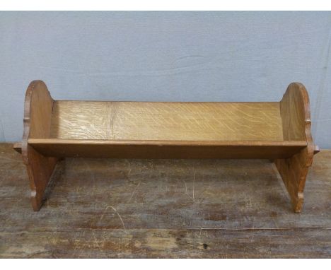 An Arts and Crafts peg jointed oak book trough, L53cm 