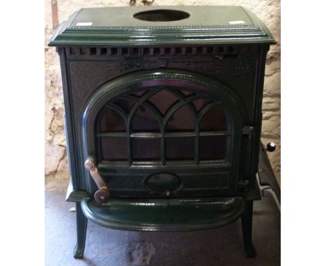 A Jotul green enamel multi-fuel stove with opening to bake (H71 x W57 X D38)