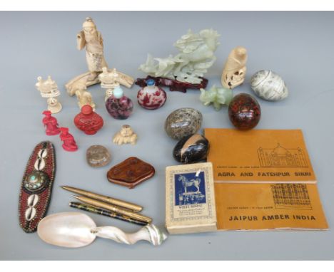 A collection of 19thC ivory figures including Japanese, Indian puzzleball chess pieces, modern jade style figures, a riveted 