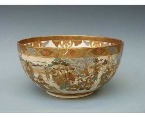 A Japanese Satsuma bowl decorated with figures to the outside and a lady playing a flute to the inside, gilt six character ma