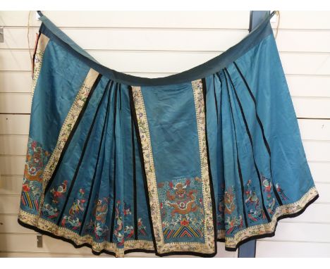 An early 20thC Chinese embroidered silk cloak, two large panels depicting a dragon chasing a flaming pearl , borders depictin