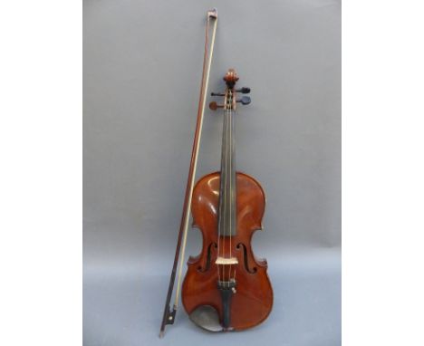 A cased violin and bow with Antonius Stradivarius label by A A Schloth Saxony, 36cm two piece flame back