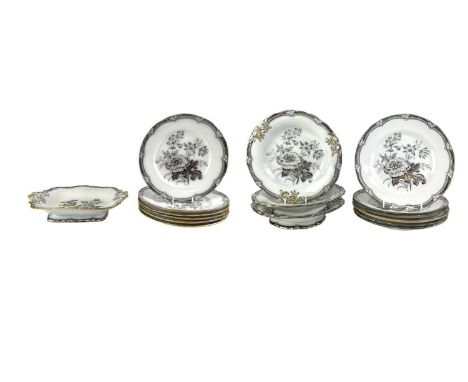 A Victorian mulberry ware dessert service. Flora pattern by Samuel Alcock, comprising twelve dessert plates, three round dish